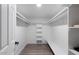 Bright walk-in closet with custom shelving and ample storage space at 10240 N 34Th Pl, Phoenix, AZ 85028