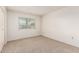 A well-lit bedroom offers neutral carpet, a window, and ample space at 10401 N 108Th Ave, Sun City, AZ 85351