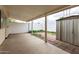 Covered patio area featuring an external storage unit and white brick perimeter wall at 10401 N 108Th Ave, Sun City, AZ 85351