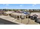 Aerial view of the home showcasing the solar panels, and desert landscaping at 10809 W Harmony Ln, Peoria, AZ 85373