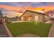 Great outdoor space with artificial turf, pool, built in bar and extended patio at 10809 W Harmony Ln, Peoria, AZ 85373