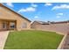 Well-maintained backyard with artificial turf, and ample space for outdoor activities and relaxation at 10809 W Harmony Ln, Peoria, AZ 85373