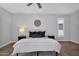 Light-filled bedroom with plantation shutters and a neutral color scheme at 10809 W Harmony Ln, Peoria, AZ 85373