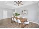 Spacious dining room featuring modern furnishings and hardwood flooring at 10809 W Harmony Ln, Peoria, AZ 85373