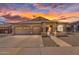 Charming single-story home boasts a three-car garage and beautiful desert landscaping at 10809 W Harmony Ln, Peoria, AZ 85373