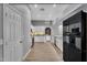 Modern kitchen with white cabinets and stainless steel appliances at 10809 W Harmony Ln, Peoria, AZ 85373