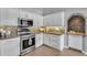 Updated kitchen with stainless steel oven and backsplash at 10809 W Harmony Ln, Peoria, AZ 85373