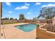 Gorgeous backyard pool featuring a fountain, surrounded by lush greenery, providing a tranquil escape at 10809 W Harmony Ln, Peoria, AZ 85373