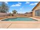 Private backyard pool surrounded by a spacious patio, ideal for enjoying sunny days and outdoor gatherings at 10809 W Harmony Ln, Peoria, AZ 85373