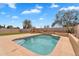 Backyard swimming pool with water feature and artificial turf, creating a serene and low-maintenance outdoor space at 10809 W Harmony Ln, Peoria, AZ 85373