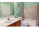 Cozy bathroom featuring a shower-tub combo, oak vanity, and a neutral color palette at 1111 W Summit Pl # 85, Chandler, AZ 85224