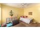 Sunny bedroom features a ceiling fan, ample space, and neutral carpeting, creating a cozy retreat at 1111 W Summit Pl # 85, Chandler, AZ 85224