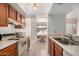 Well-lit kitchen connects to the dining area and features classic cabinetry and appliances at 1111 W Summit Pl # 85, Chandler, AZ 85224