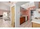 Functional kitchen with essential appliances and ample storage, leading to in-unit laundry at 1111 W Summit Pl # 85, Chandler, AZ 85224