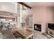 Open-concept living space features a fireplace, an airy dining area, and seamless flow to the kitchen at 1111 W Summit Pl # 85, Chandler, AZ 85224