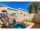 Charming patio with colorful string lights, potted plants, and a cozy seating area at 1111 W Summit Pl # 85, Chandler, AZ 85224