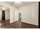 A spacious bedroom with a mirrored closet and wood-look floors, and an en-suite bathroom at 11429 W Yavapai St, Avondale, AZ 85323