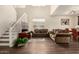 Bright living room with high ceilings, wood floors, staircase, and comfortable seating at 11429 W Yavapai St, Avondale, AZ 85323