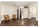 Inviting living room with wood floors, natural light, comfortable seating, and a welcoming entrance at 11429 W Yavapai St, Avondale, AZ 85323