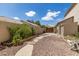 Low maintenance backyard with gravel, pavers and a small garden at 1181 N Dustin Ln, Chandler, AZ 85226