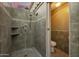 Modern bathroom featuring a shower, showcasing tiled walls, and toilet at 1181 N Dustin Ln, Chandler, AZ 85226