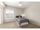 Simple bedroom with a neutral palette, large window, and comfortable queen size bed at 1181 N Dustin Ln, Chandler, AZ 85226