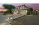The house has a three-car garage with a large driveway and mature landscaping at 1181 N Dustin Ln, Chandler, AZ 85226