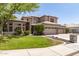 Two-story home featuring mature landscaping and a three-car garage at 1181 N Dustin Ln, Chandler, AZ 85226