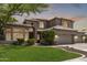 Beautiful two-story home featuring lush landscaping and a three-car garage at 1181 N Dustin Ln, Chandler, AZ 85226