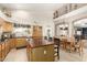 Bright kitchen featuring a spacious island, ample cabinet space, and a view of the dining area at 1181 N Dustin Ln, Chandler, AZ 85226