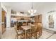 Open-concept kitchen and dining area with a large island, stainless steel appliances, and casual seating at 1181 N Dustin Ln, Chandler, AZ 85226