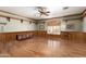 Spacious living room featuring hardwood floors, wood trim, and a large window providing natural light at 1181 N Dustin Ln, Chandler, AZ 85226