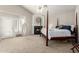 Tranquil main bedroom boasts a cozy fireplace and four-poster bed at 1181 N Dustin Ln, Chandler, AZ 85226