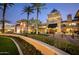 An exterior shot of a retail storefront with manicured landscaping and plenty of lighting at 1181 N Dustin Ln, Chandler, AZ 85226