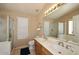 Bathroom features a double sink vanity, shower and bath with natural light at 1212 W Vera Ln, Tempe, AZ 85284