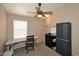 Cozy bedroom with a ceiling fan, a dedicated desk, and ample storage making it perfect for a restful nights sleep at 1212 W Vera Ln, Tempe, AZ 85284