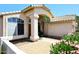 Inviting entryway with decorative tile, pillars, and mature landscaping at 1212 W Vera Ln, Tempe, AZ 85284