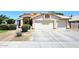 Charming single-Gathering home featuring a three car garage, desert landscaping, and beautiful tile roof at 1212 W Vera Ln, Tempe, AZ 85284