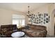 Comfortable living room with neutral tones, plush seating, and bright window views at 1212 W Vera Ln, Tempe, AZ 85284