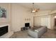 Inviting living area featuring a fireplace and ample natural light at 1212 W Vera Ln, Tempe, AZ 85284