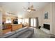 Inviting space with kitchen, fireplace, and backyard access offering a seamless flow for everyday living and entertaining at 1212 W Vera Ln, Tempe, AZ 85284