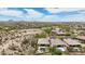 Expansive aerial view showcases desert home, pool, landscaping, and mountain views in the distance at 12381 S 182Nd Dr, Goodyear, AZ 85338