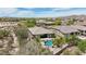 Aerial view of desert home showing a pool, yard with desert landscaping, and well-kept neighborhood at 12381 S 182Nd Dr, Goodyear, AZ 85338