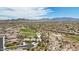 Aerial image features community homes, a golf course, sparse desert vegetation, and mountains with a home location pin at 12381 S 182Nd Dr, Goodyear, AZ 85338