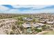 Gorgeous aerial view featuring a luxury home with a pool, desert landscaping, and community at 12381 S 182Nd Dr, Goodyear, AZ 85338