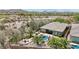 Inviting backyard featuring a pool, hot tub, outdoor kitchen, and desert landscaping, perfect for entertaining at 12381 S 182Nd Dr, Goodyear, AZ 85338