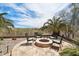 Cozy backyard with a fire pit, comfortable seating, and desert landscaping at 12381 S 182Nd Dr, Goodyear, AZ 85338