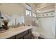 Bathroom featuring a vanity, toilet, and glass enclosed shower with white subway tile at 12381 S 182Nd Dr, Goodyear, AZ 85338