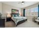 Bedroom features an upholstered bed, shuttered windows, soft carpet, and a ceiling fan at 12381 S 182Nd Dr, Goodyear, AZ 85338