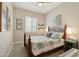 Cozy bedroom features a ceiling fan, shuttered windows, and sea-themed decor for a relaxing ambiance at 12381 S 182Nd Dr, Goodyear, AZ 85338